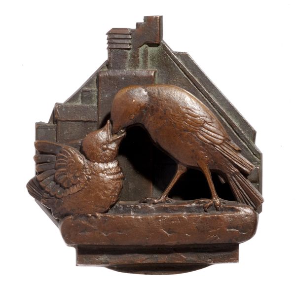 An unusual small bronze door knocker in the form of a bird feeding its young indistinctly stamped GM and dated 1934 11cm high by 10cm wide