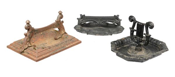 A Kenrick foundry cast iron boot scraper mid 19th century in the form of a lyre 28cm high, together with another Victorian boot scraper with lobed...