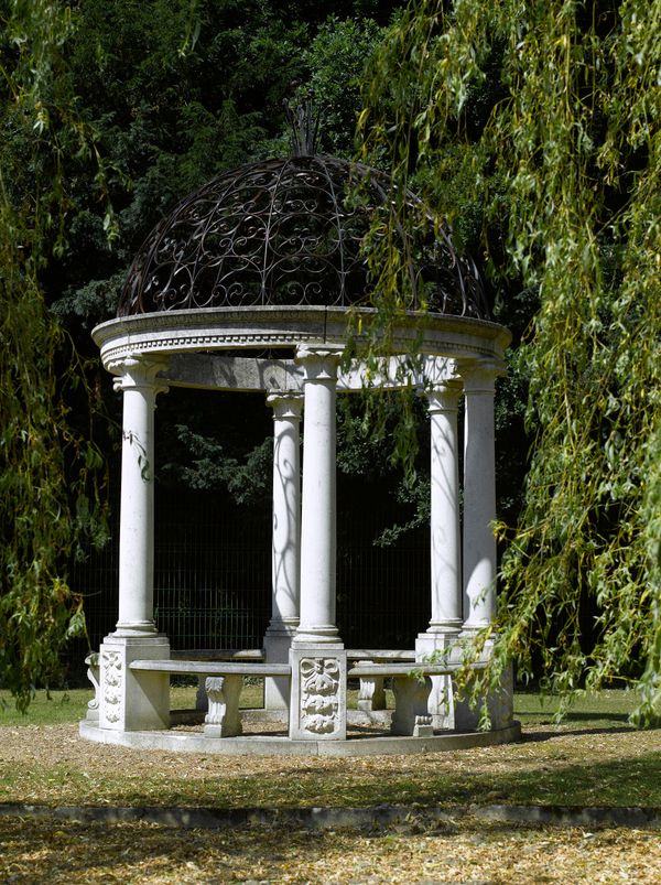 † A large carved limestone and wrought iron rotunda modern 475cm high by 305cm diameter