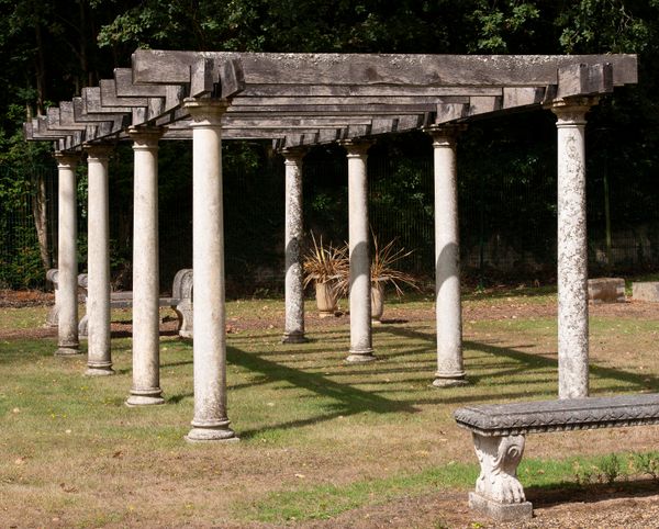 † A carved limestone and oak pergola modern 250cm high by 350cm wide by 800cm long