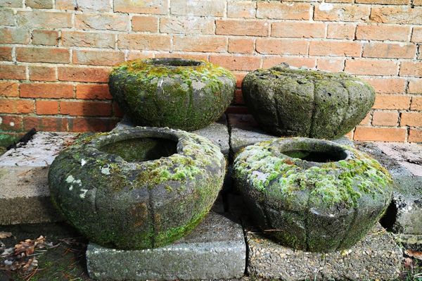 A set of four composition stone pots 20th century 25cm high by 49cm wide