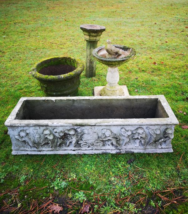 A rectangular composition stone trough 20th century 120cm long, together with two composition stone bird baths and a circular planter