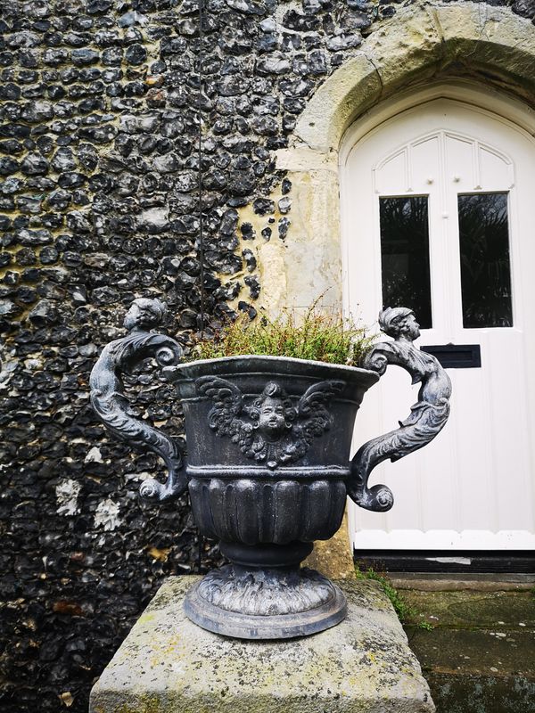 A pair of William and Mary style lead urns mid 20th century 48cm high