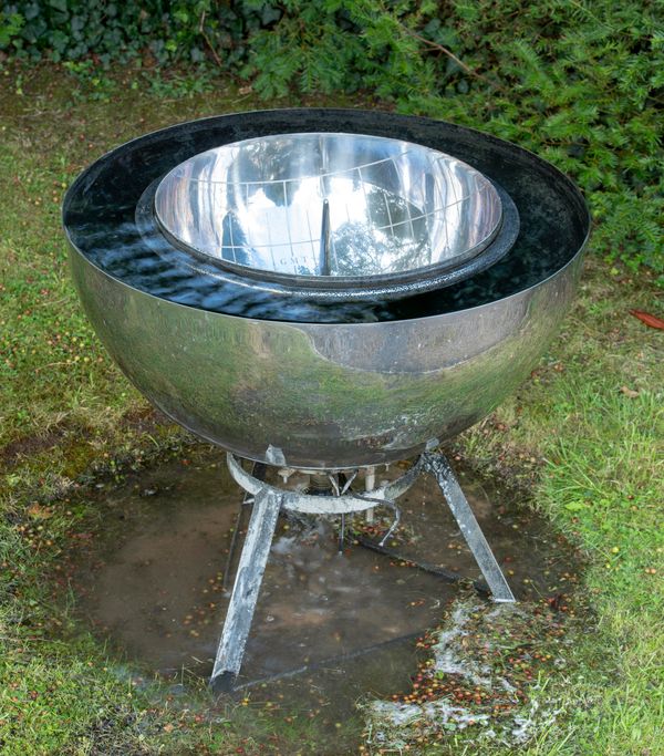 David Harber Chalice Stainless steel water feature, the centre with sundial on metal stand 74cm high overall by 78cm diameter