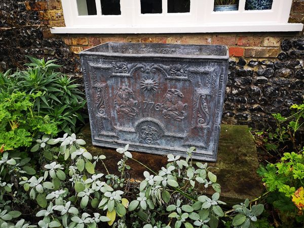 A Georgian style lead cistern 2nd half 20th century bearing the date 1776 70cm high by 92cm wide by 51cm deep