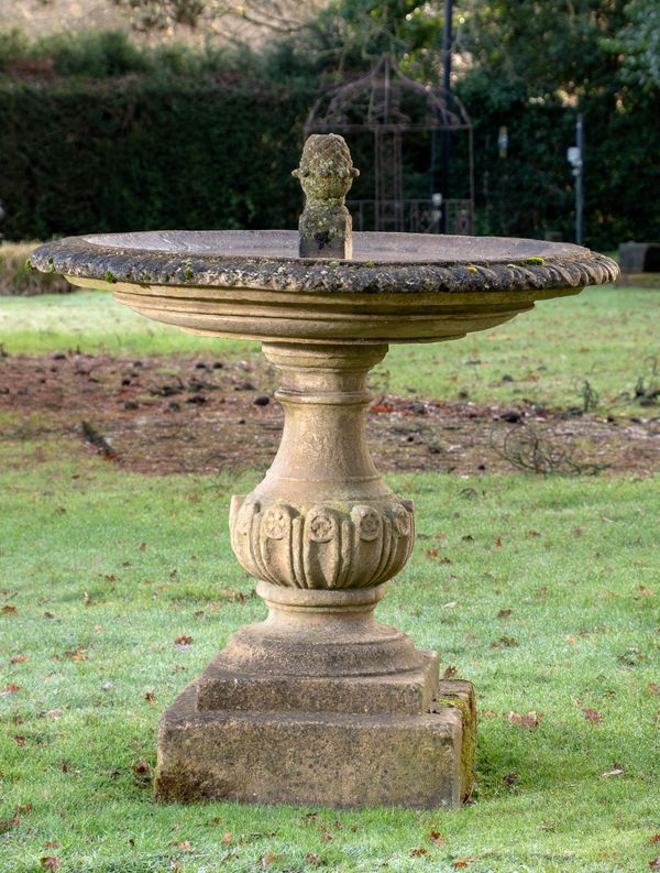 A composition stone single tier fountain modern 154cm high by 130cm diameter