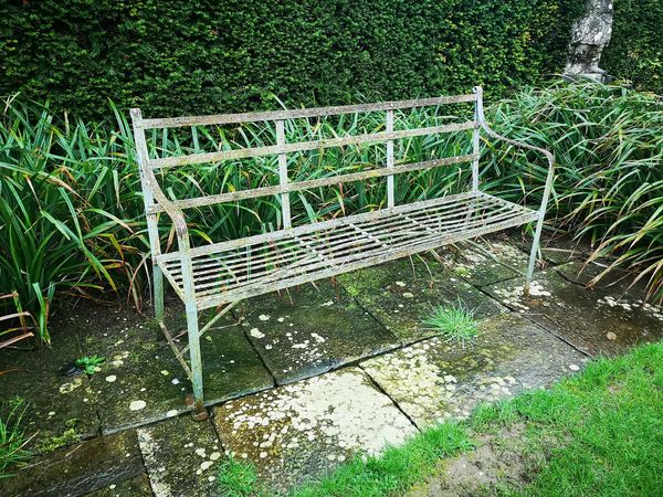 A Regency reeded wrought iron seat early 19th century 164cm wide