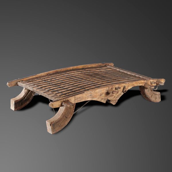 An iron mounted wooden threshing table 19th century, possibly Scandinavian 44cm high by 185cm long