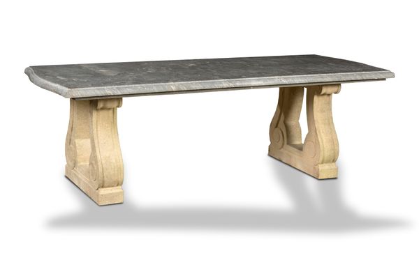 A grey veined marble table modern on carved limestone supports 251cm long by 100cm wide