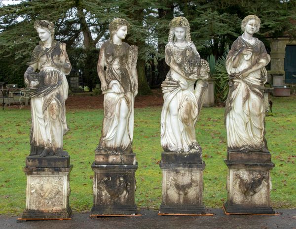 A set of four carved white marble figures representing the seasons on pedestals modern 204cm high overall