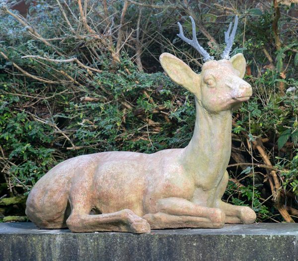 A composition stone deer modern with lead antlers 96cm long