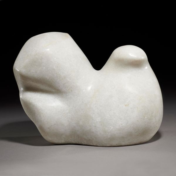 A carved white marble stylised bird modern 26cm long