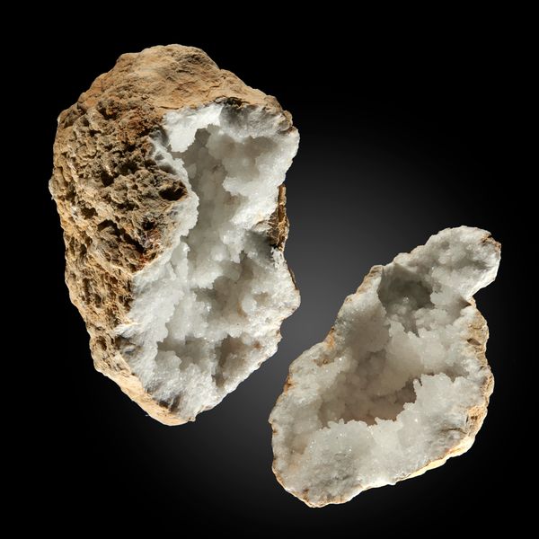 A large quartz geode in two pieces Moroccan 59cm wide