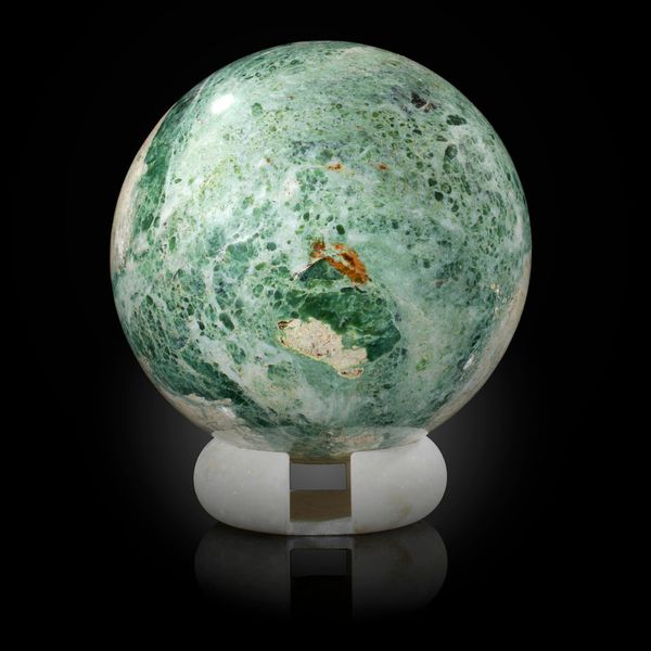 A serpentine sphere Himalayas on marble stand 18cm diameter, 10kg