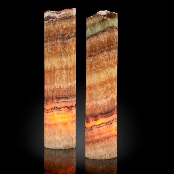 A pair of polished cylindrical onyx lamps Mexico 30cm high