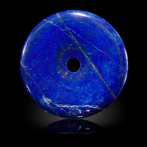 An unusual lapis lazuli disc 15cm diameter