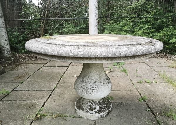 †A carved limestone table, modern  75cm high, 120cm diameter 