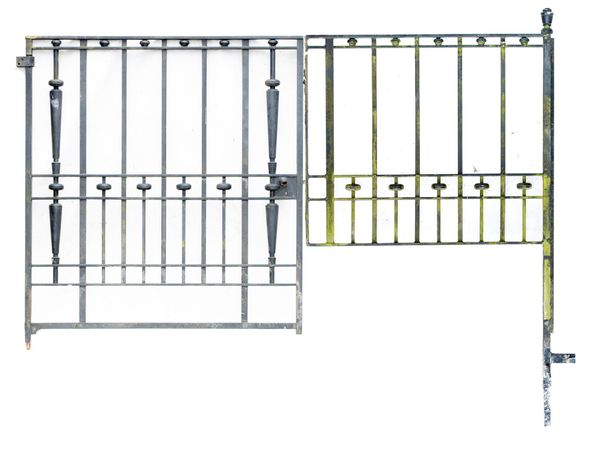 A substantial wrought iron gate early 20th century with side panel and upright the gate 150cm high by 140cm wide, the panel 124cm wide