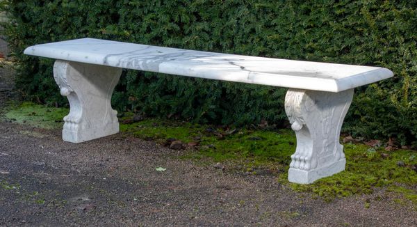A carved white marble bench Italian, circa 1900  with later veined marble top 183cm long