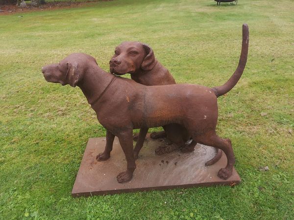 A cast iron group of two dogs modern 70cm high by 87cm long