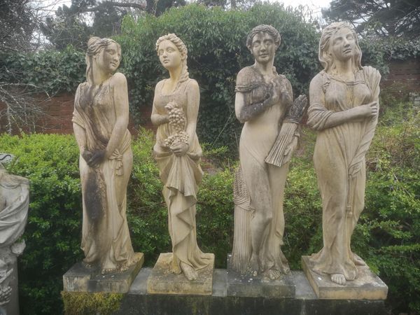 A set of four composition stone figures representing the Seasons late 20th century 145cm high