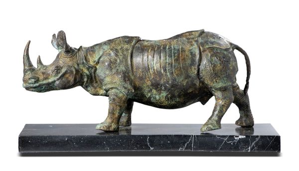 A bronze rhinoceros modern  on marble base 38cm long  