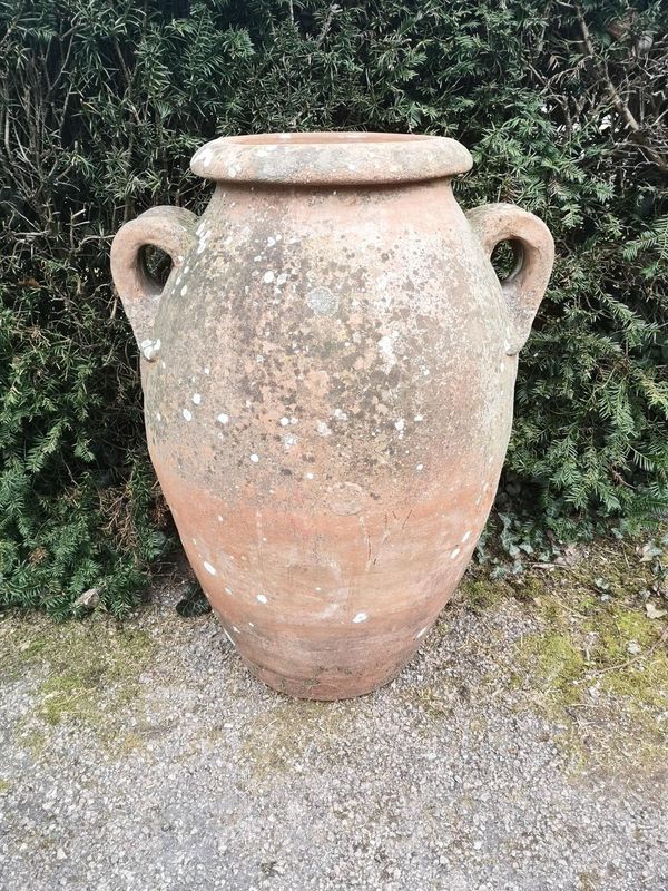 A terracotta storage jar early 20th century possibly by Compton, bearing two circular makers marks 82cm high  Although this model does not appear in...