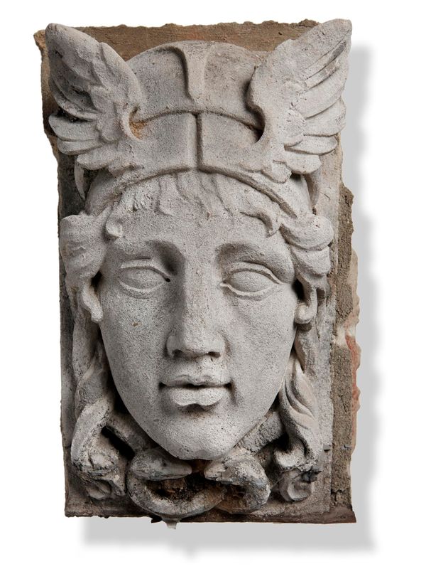 A carved Portland stone keystone carved in high relief with a Hermes mask circa 1900 31cm high