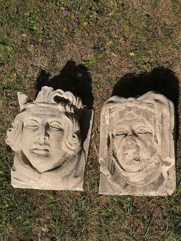 A pair of Victorian gothic style carved stone architectural heads of a king and queen mid 19th century  24cm high