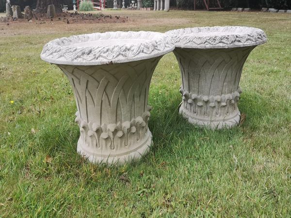 A pair of composition stone basket planters modern 38cm high by 60cm diameter