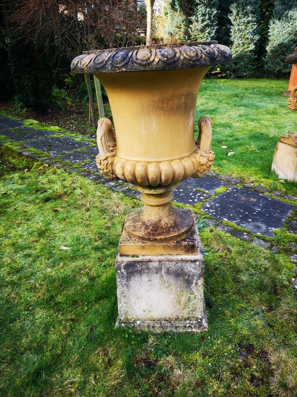 A pair of Doulton style composition stone urns on pedestals 2nd half 20th century 108cm high