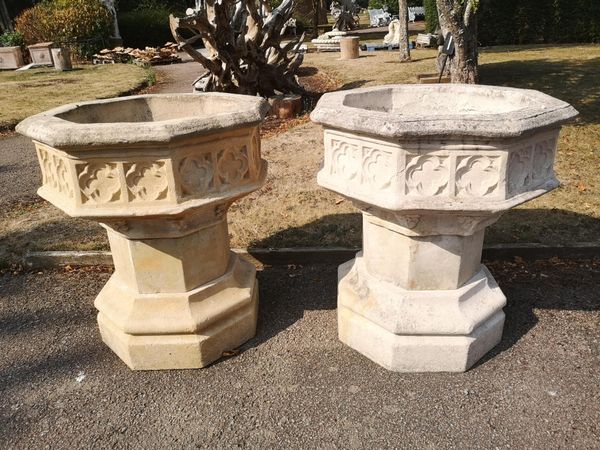 A pair of Gothic-style octagonal composition stone planters on stands modern 90cm high by 79cm wide