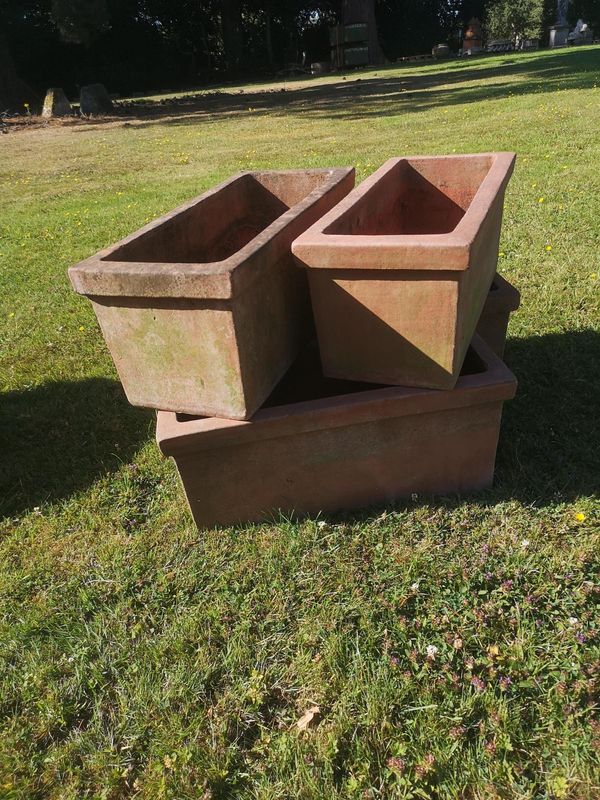 A similar set of four rectangular terracotta planters