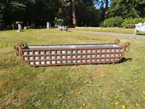 An unusual and rare wrought iron brazier/planter Northern European, late 19th century with later zinc liner 31cm high by 168cm long