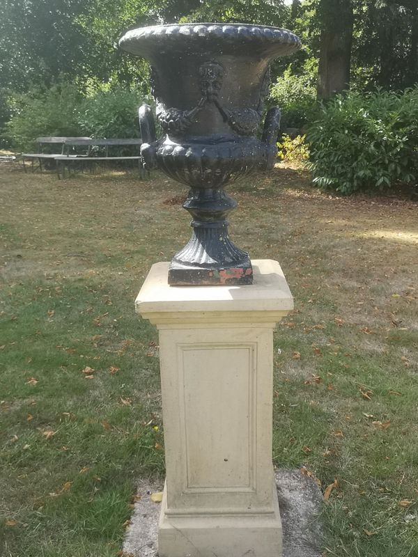 A Victorian cast iron urn on associated fireclay pedestal 140cm high pedestal stamped Lindsay and Anderson, Lillie Hill, Terracotta Works, Dumfermlin