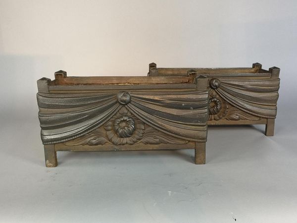 A pair of unusual cast iron rectangular planters late 19th century 28cm high by 50cm long