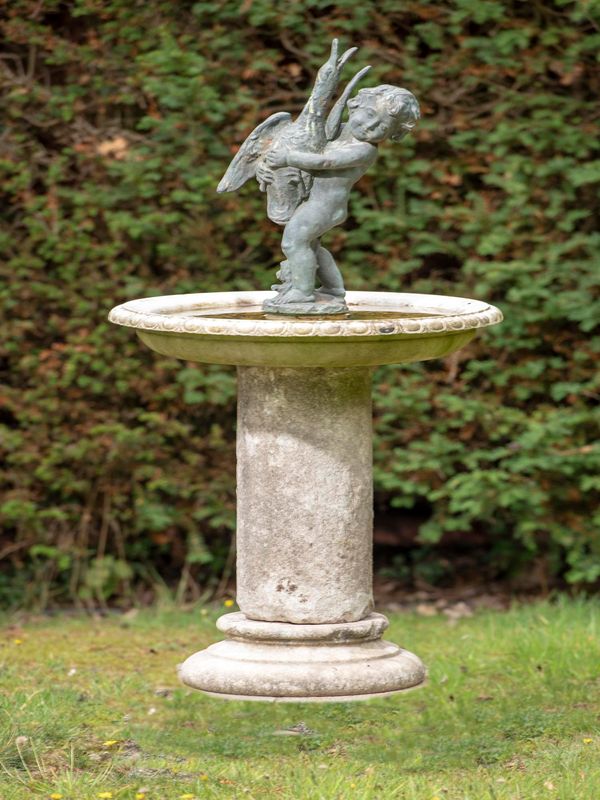 A bronze and carved white marble birdbath 19th century the associated bronze figure of a putto holding a goose with mouth plumbed for water 120cm...