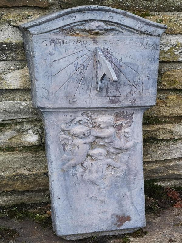 An unusual lead wall sundial 2nd half 20th century 75cm high