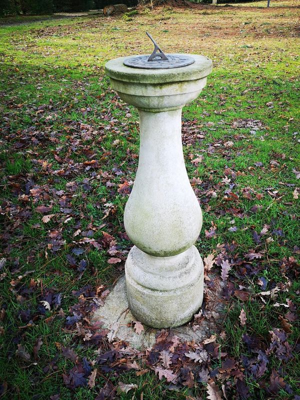 A composition stone sundial modern with 7in plate 100cm high