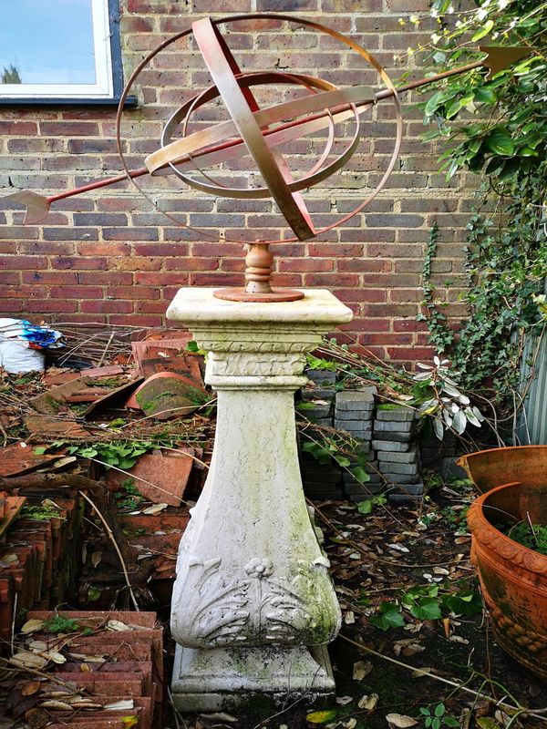 A wrought iron armillary sundial late 20th century on earlier Istrian stone pedestal, early 20th century, the pedestal 116cm high; 180cm high...