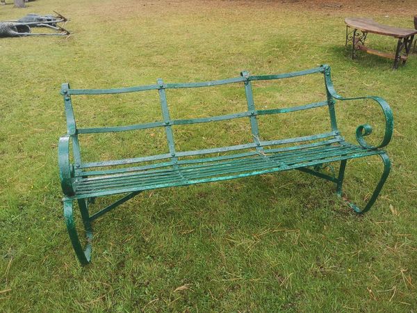 A wrought iron seat late 19th century 150cm wide