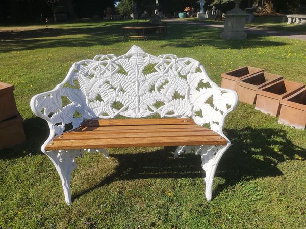 A Coalbrookdale style Fern and Blackberry pattern seat last quarter 20th century with faux diamond registration stamp 116cm wide