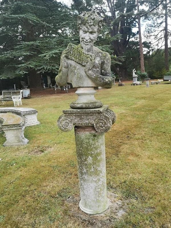 A composition stone bust of Pan after a model by the Bromsgrove Guild 2nd half 20th century on pedestal 190cm high