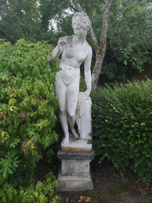 After the Antique: A composition stone figure of Venus on pedestal modern 210cm high