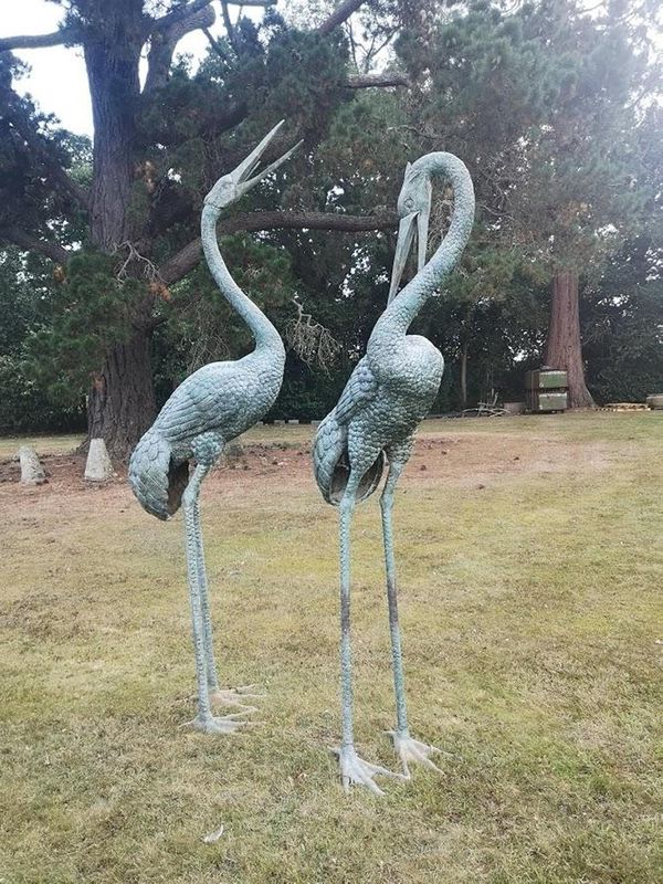 A pair of Japanese style bronze cranes modern each beak plumbed for water 270cm high