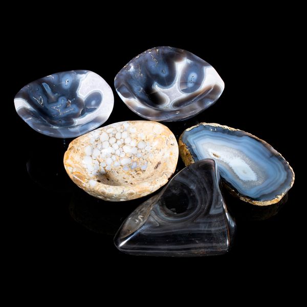 Five semi-precious stone bowls consisting of agate from Madagascar, agate from Brazil, rainbow obsidian from Mexico and cobra jasper from India the...