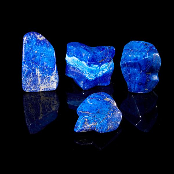A group of four lapis lazuli freeforms the largest 12cm 
