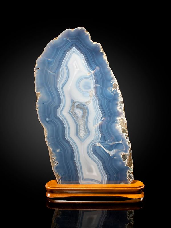 A blue agate slice on wooden stand Brazil 61cm