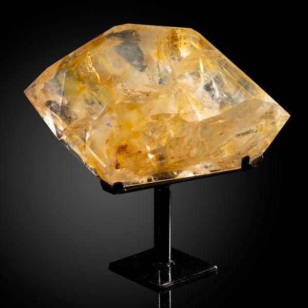 A limonitic quartz freeform on metal base Brazil 28cm wide
