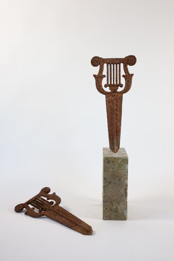 A pair of cast iron boot scrapers